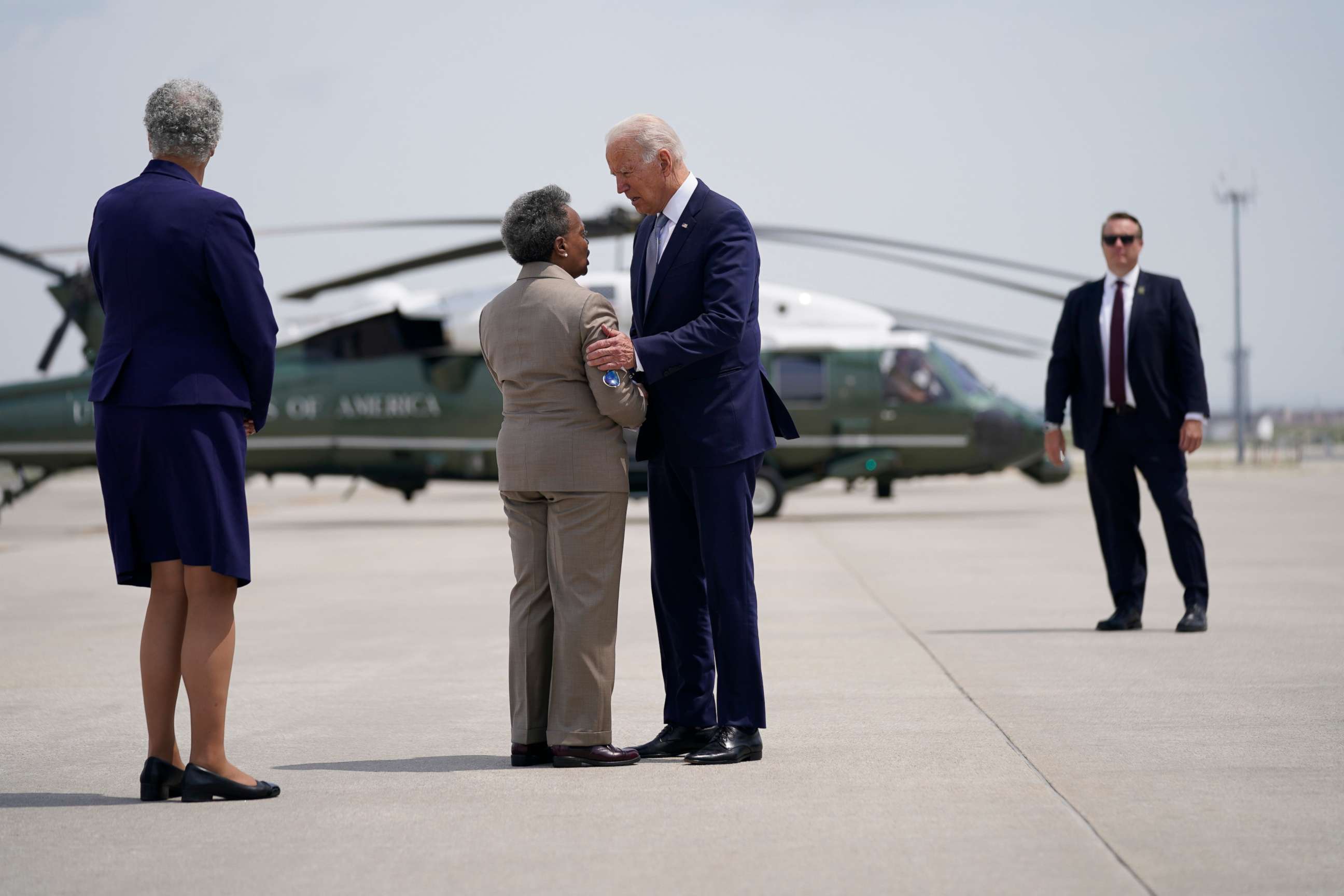 PHOTO: President Joe Biden is greeted by Cook County Board of Commissioners President Toni Preckwinkle, left, and Chicago Mayor Lori Lightfoot at O'Hare International Airport, July 7, 2021, in Chicago.