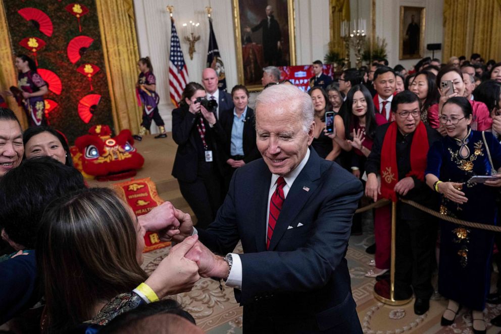 PHOTO: President Joe Biden shakes hands with guests as he leaves the reception to celebrate the Lunar New Year, in the East Room of the White House in Washington, DC, on Jan. 26, 2023.