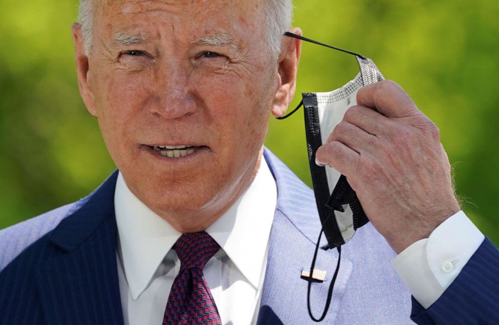 PHOTO: President Joe Biden removes his face mask as he delivers remarks on the administration's COVID-19 response outside the White House in Washington, D.C., April 27, 2021.