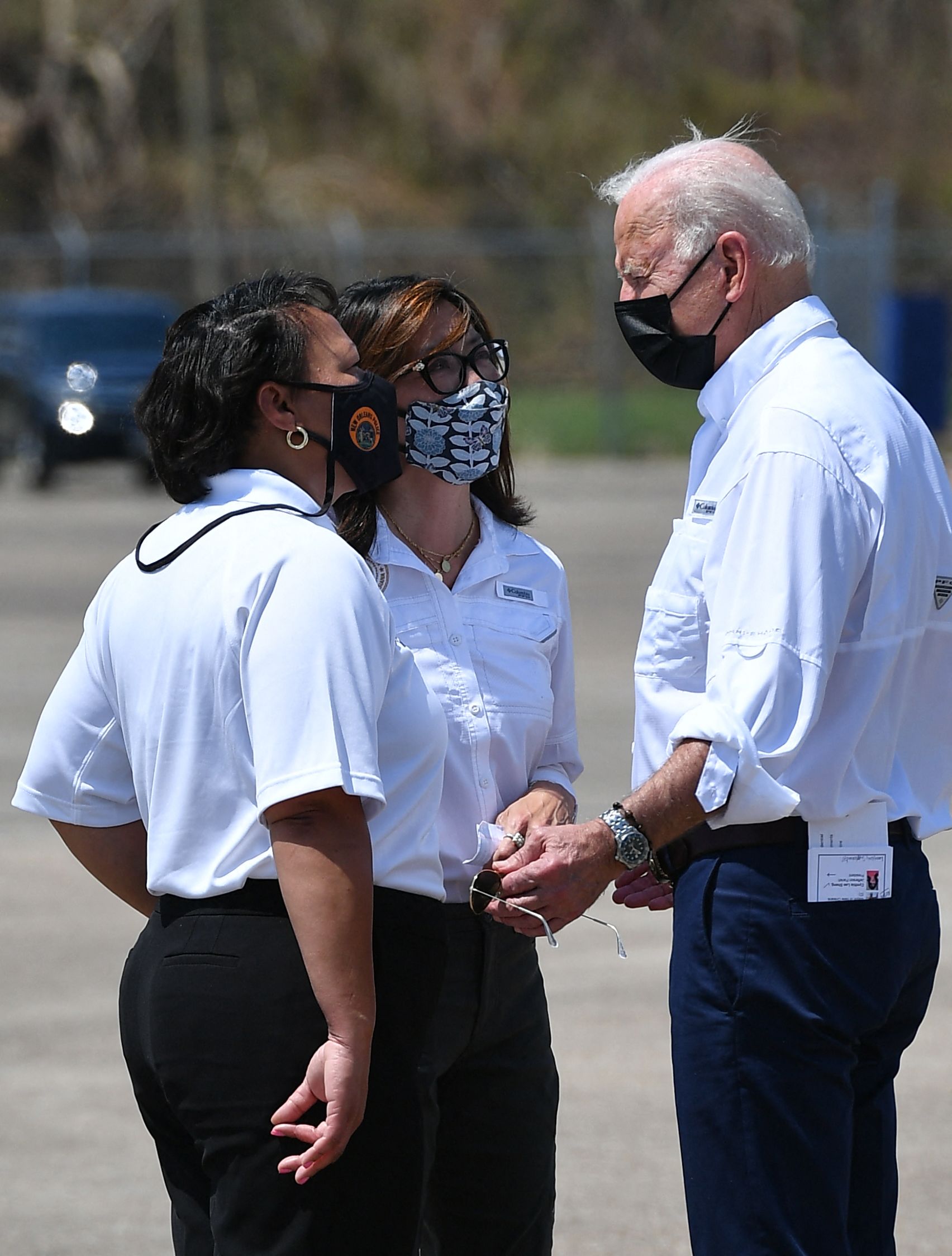 PHOTO: President Joe Biden speaks with New Orleans Mayor LaToya Cantrell, left, and  Jefferson Parish President Cynthia Lee Sheng upon arrival at Louis Armstrong New Orleans International Airport in Kenner, LA. on Sept. 3, 2021.