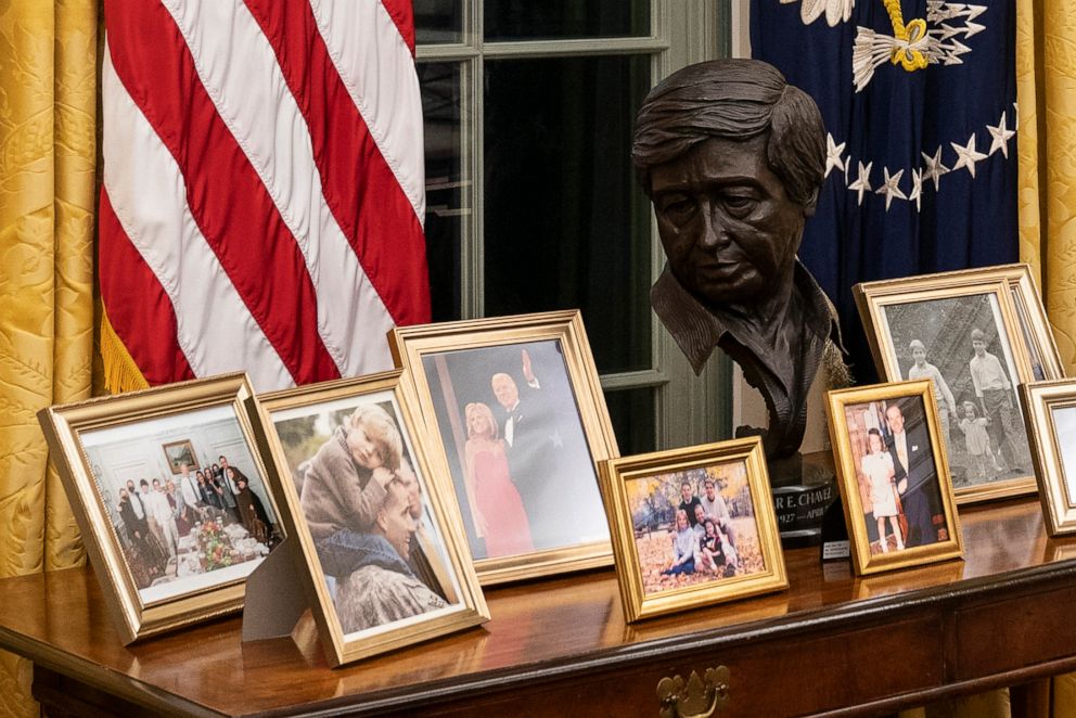 PHOTO: This Jan. 20, 2021, file photo shows the newly redecorated Oval Office of the White House in Washington, including family photos and a bust of the late Cesar Chavez.