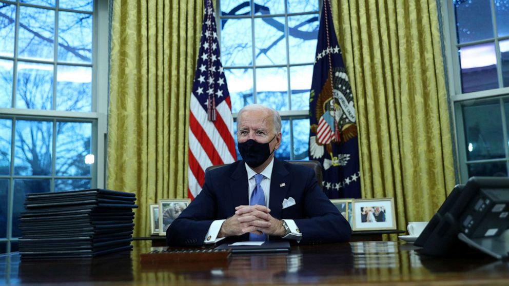 PHOTO: President Joe Biden sits in the Oval Office of the White House in Washington, after his inauguration as the 46th President of the United States, Jan. 20, 2021.