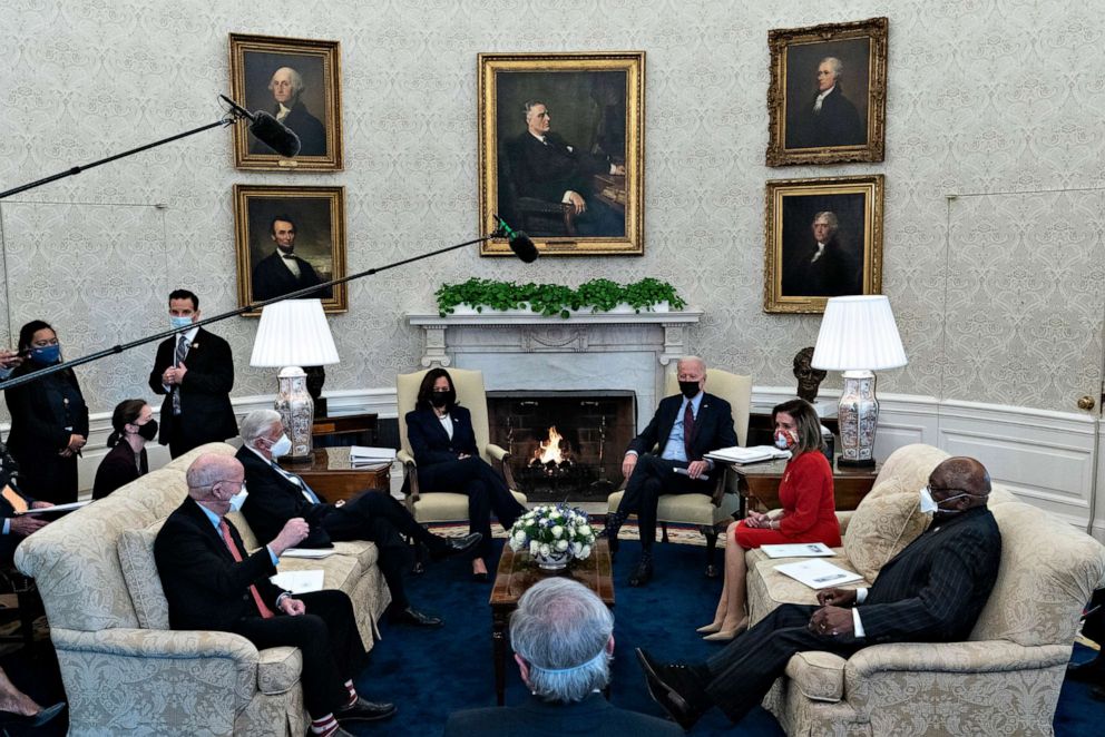 PHOTO: President Joe Biden, accompanied by Vice President Kamala Harris, speaks with House Speaker Nancy Pelosi and House Majority Whip James Clyburn, right, House Majority Leader Steny Hoyer, seated second left, in Washington.