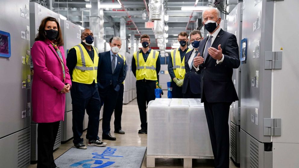 PHOTO: President Joe Biden, right, and Michigan Gov. Gretchen Whitmer, left, tour a Pfizer manufacturing site, Friday, Feb. 19, 2021, in Portage, Mich. (AP Photo/Evan Vucci)