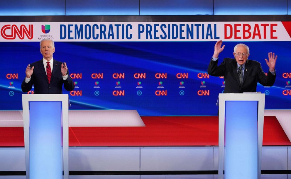 PHOTO: Democratic presidential hopefuls former vice president Joe Biden and Sen. Bernie Sanders take part in the presidential debate in Washington, DC, March 15, 2020.