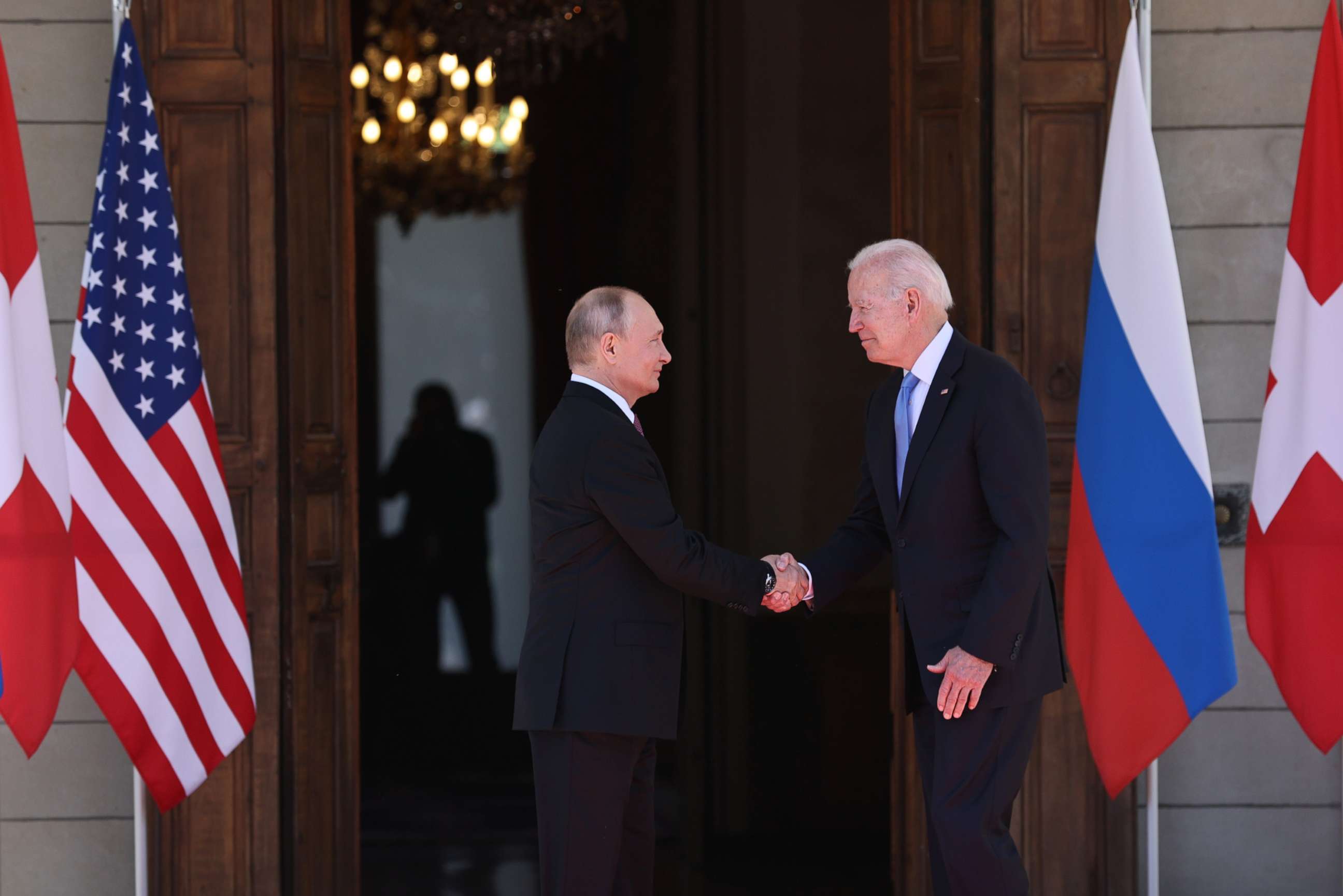 PHOTO: Russia's President Vladimir Putin and President Joe Biden shake hands as they meet for a Russia-United States summit in Geneva, June 16, 2021. 