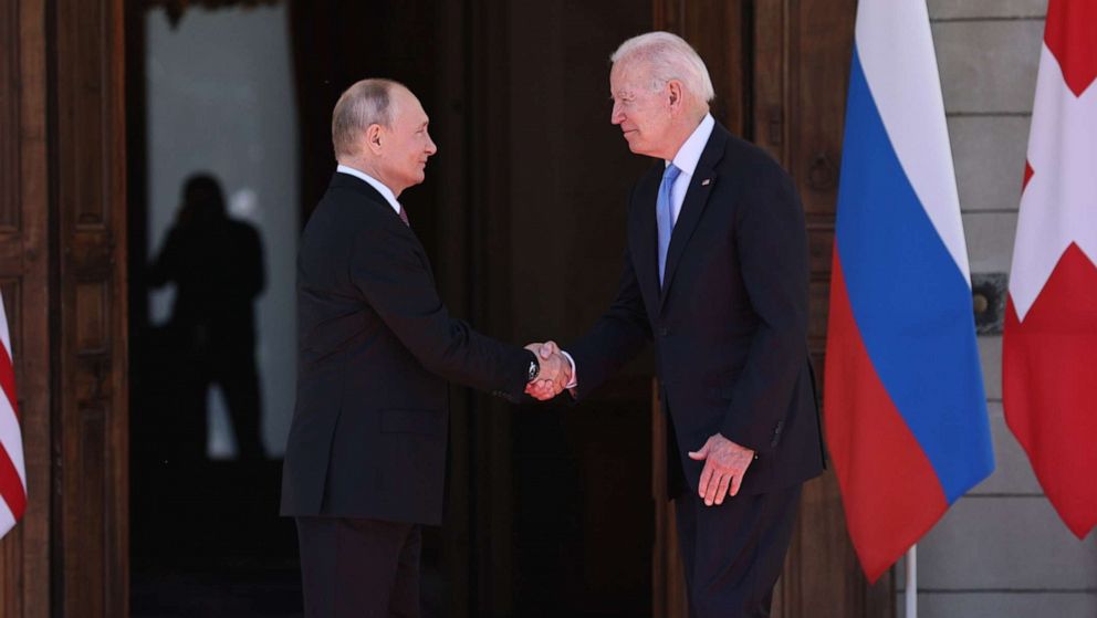 PHOTO: Russia's President Vladimir Putin and President Joe Biden shake hands as they meet for a Russia-United States summit in Geneva, June 16, 2021. 
