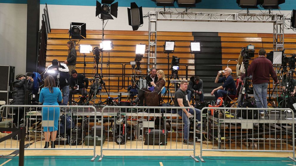 PHOTO: Members of the media work before a planned primary night rally for Democratic presidential candidate former Vice President Joe Biden at the Cuyahoga Community College Recreation Center on March 10, 2020, in Cleveland.