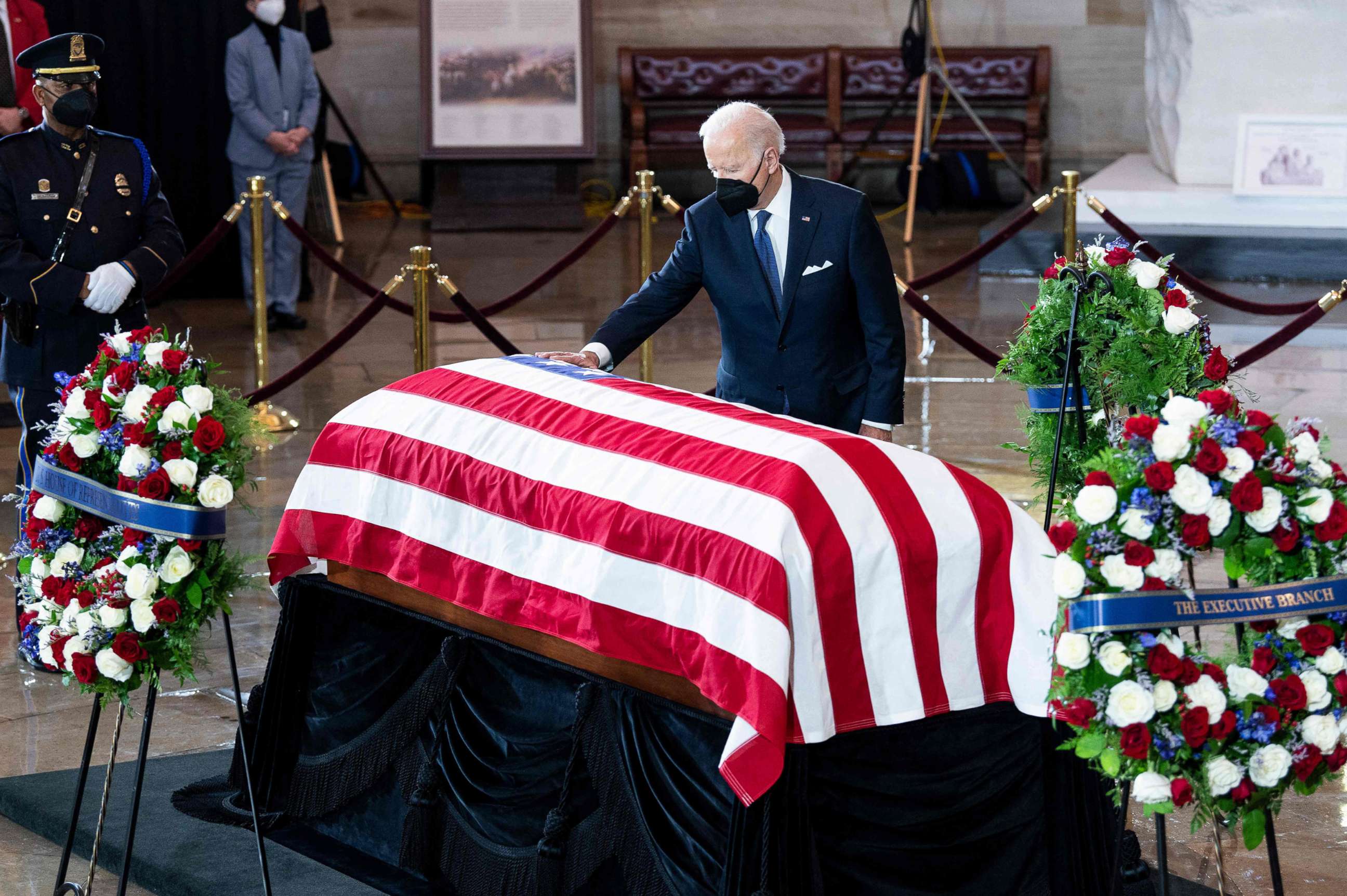 PHOTO: President Joe Biden touches the flag-draped casket former Senate Majority Leader Harry Reid as he pays his respects during a Congressional ceremony as Reid lies in state at the U.S. Capitol in Washington, Jan. 12, 2022.