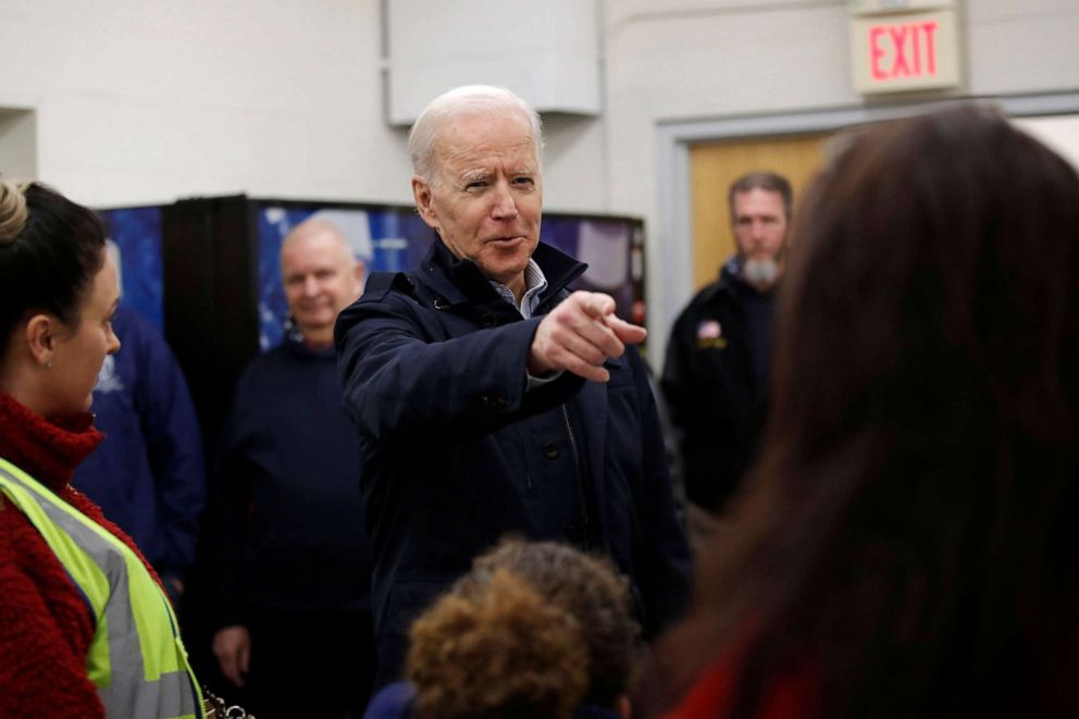 PHOTO: Democratic presidential candidate and former Vice President Joe Biden chats with school bus drivers during a visit at a bus garage while campaigning in Nashua, N.H., Feb. 10, 2020.
