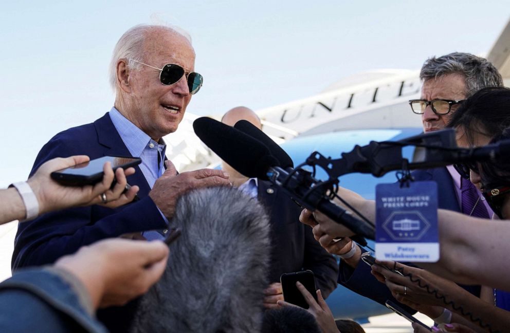 PHOTO: President Joe Biden talks to reporters while boarding Air Force One from Delaware Air National Guard Base in New Castle, Del., Aug. 8, 2022.