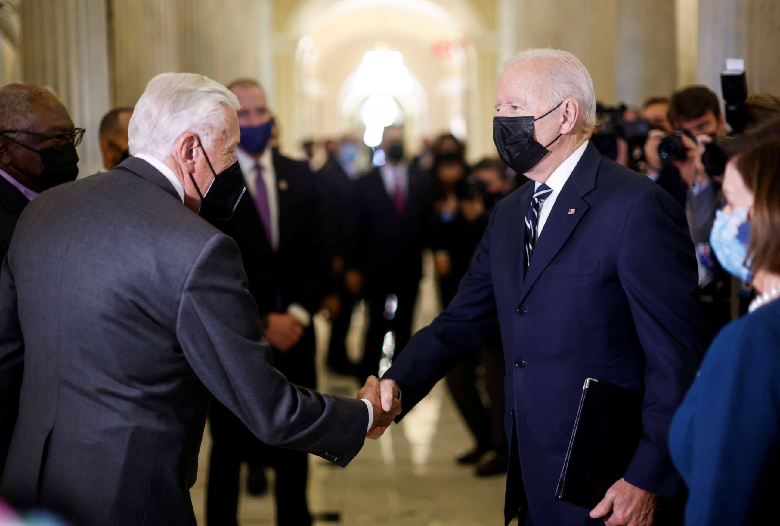 PHOTO: President Joe Biden is greeted by House Majority Leader Steny Hoyer as he arrives to speak to the House Democratic Caucus at the U.S. Capitol in Washington, Oct. 28, 2021.