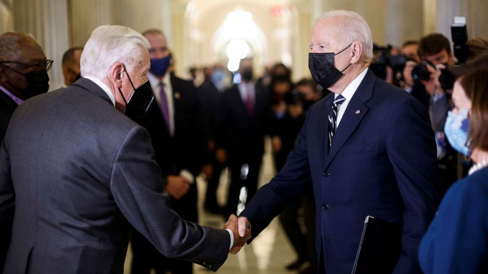 PHOTO: President Joe Biden is greeted by House Majority Leader Steny Hoyer as he arrives to speak to the House Democratic Caucus at the U.S. Capitol in Washington, Oct. 28, 2021.