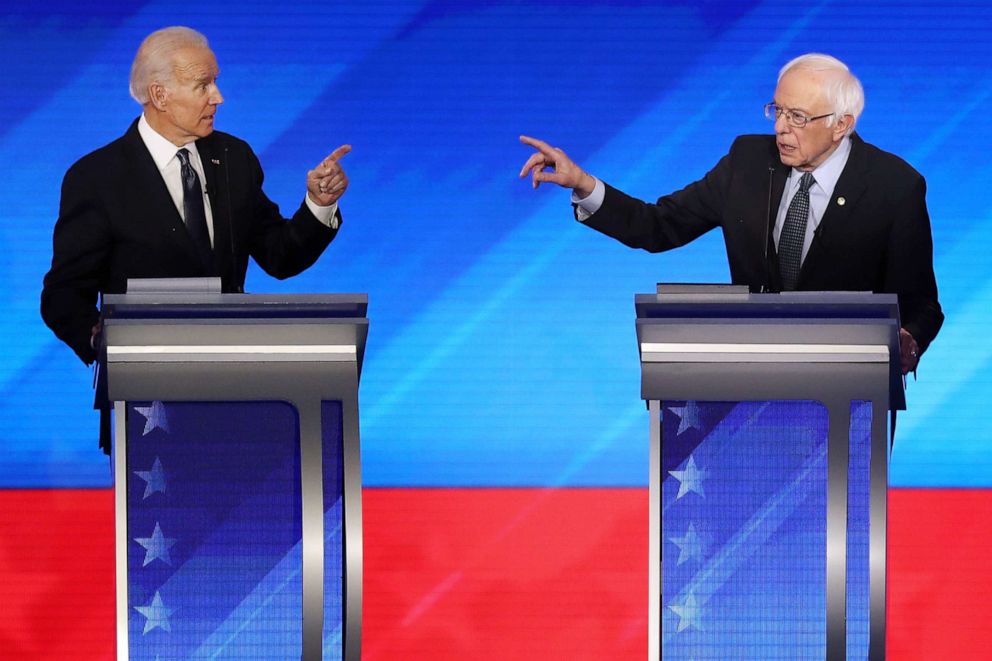 PHOTO: Democratic presidential candidates former Vice President Joe Biden and Sen. Bernie Sanders participate in the Democratic presidential primary debate at St. Anselm College on Feb. 7, 2020 in Manchester, N.H.
