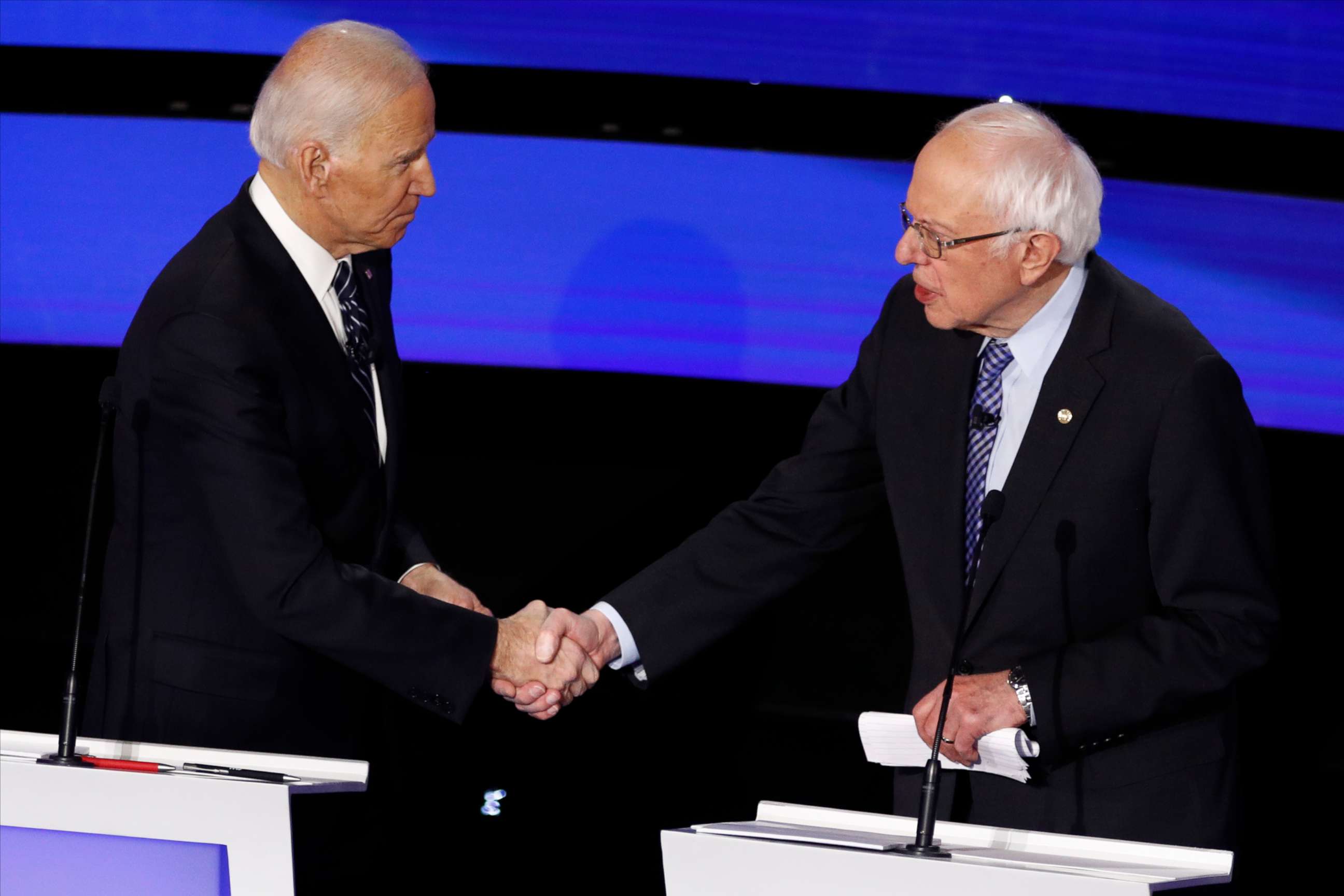 PHOTO: Former Vice President Joe Biden, left, and Sen. Bernie Sanders shake hands after a Democratic presidential primary debate hosted by CNN and the Des Moines Register in Des Moines on Jan. 14, 2020.