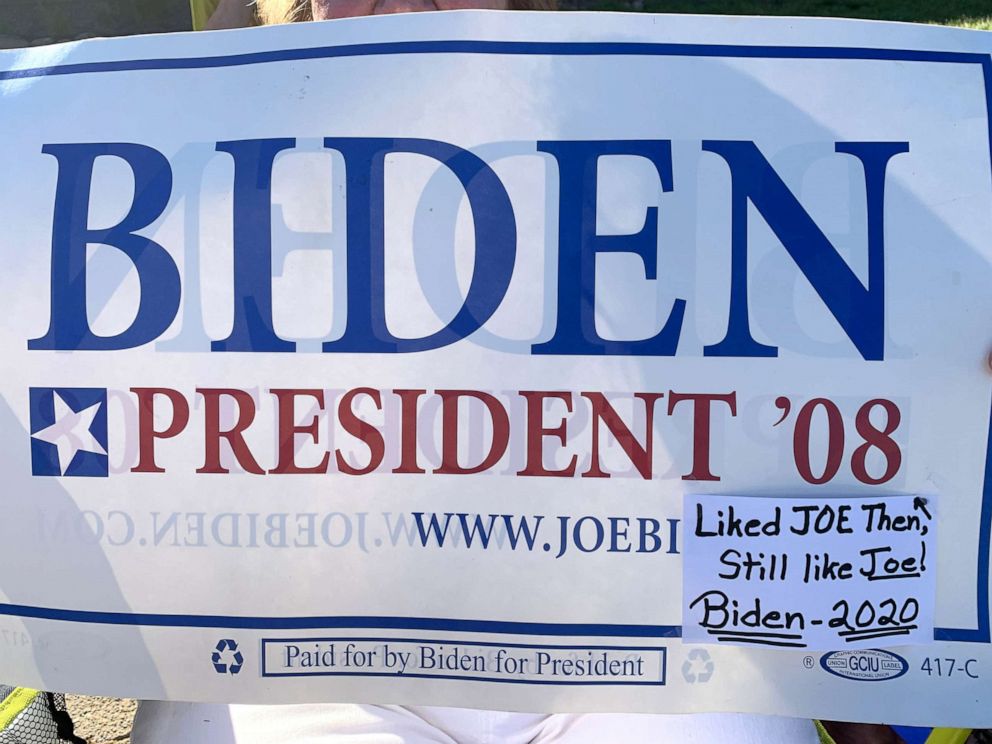 PHOTO: Mary Klein holds a "Biden President '08" sign with amended caption in Sioux City, Iowa, July 16, 2019.