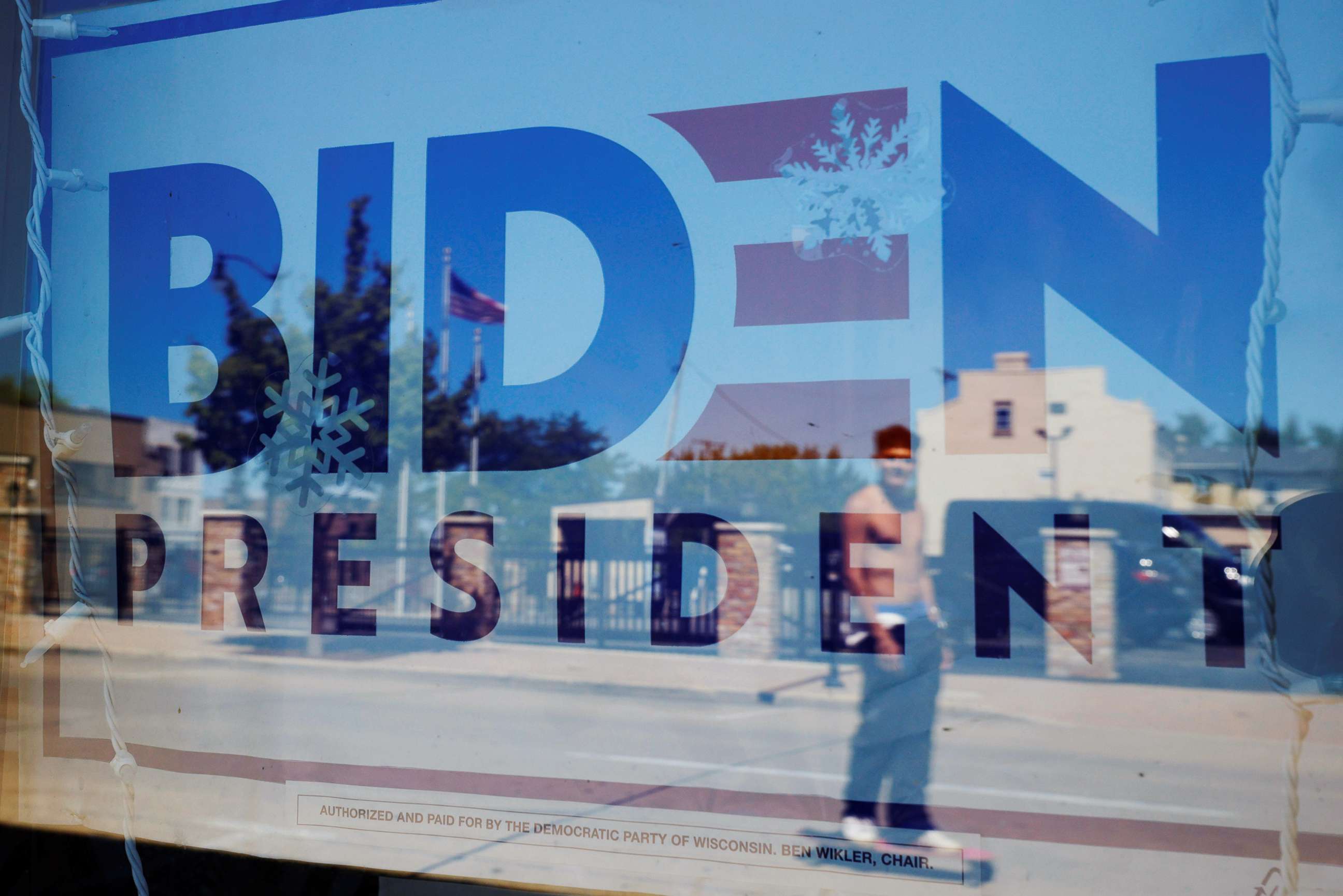 PHOTO: A sign supporting Democratic presidential nominee Joe Biden hangs in the window of the Racine County Democratic Party office, during the largely virtual Democratic National Convention (DNC), in Racine, Wis., Aug. 19, 2020.