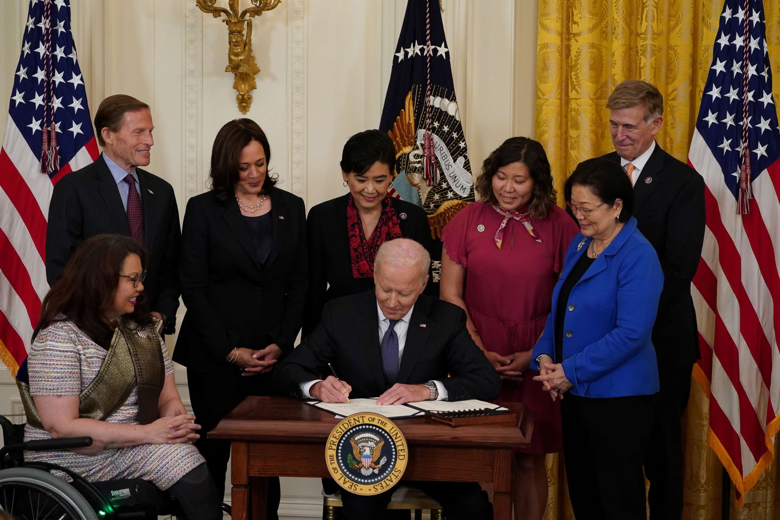 PHOTO: President Joe Biden signs the COVID-19 Hate Crimes Act into law during a ceremony in the East Room at the White House in Washington, D.C., May 20, 2021.