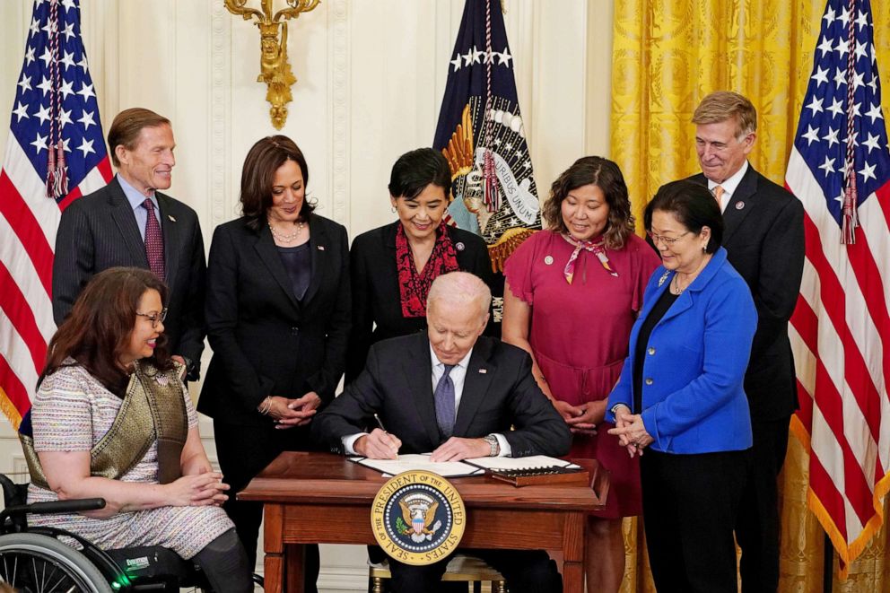 PHOTO: President Joe Biden signs the COVID-19 Hate Crimes Act into law during a ceremony in the East Room at the White House in Washington, May 20, 2021.