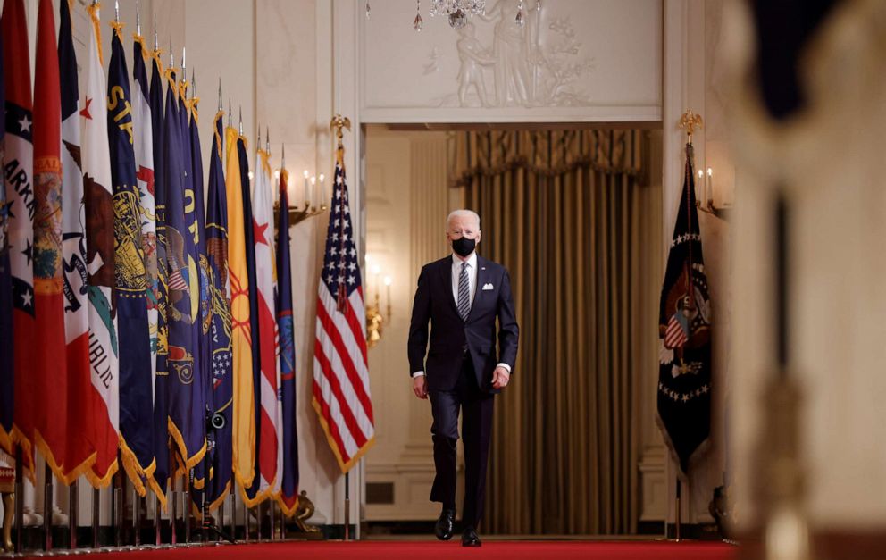 PHOTO: President Joe Biden walks up the Cross Hall as he arrives to deliver his first prime-time address as president, marking the one-year anniversary of widespread shutdowns to combat the COVID-19 pandemic, March 11, 2021.