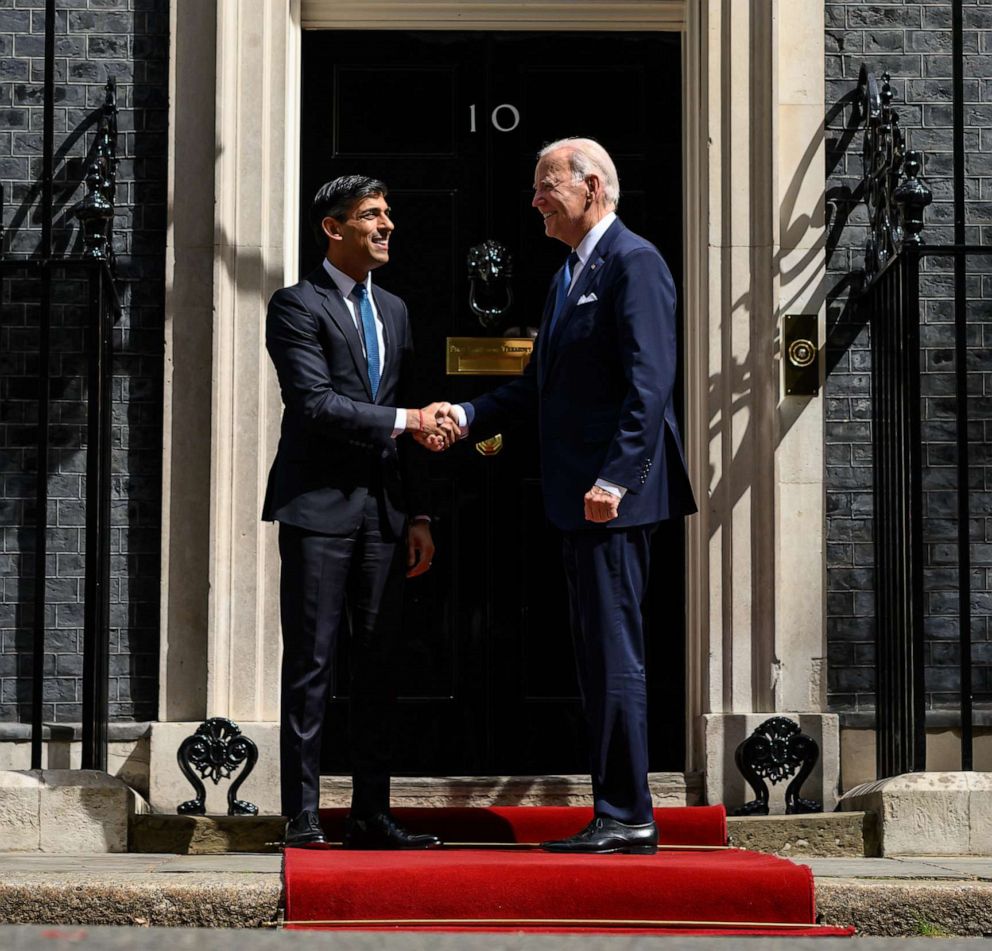 PHOTO: Britain's Prime Minister Rishi Sunak greets US President Joe Biden on the doorstep of 10 Downing Street ahead of a bi-lateral meeting on July 10, 2023 in London.