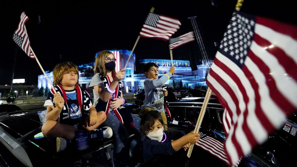 PHOTO: Supporters of President-elect Joe Biden, who is set to become the 46th president of the United States, get ready for him to speak in Wilmington, Del., Nov. 7, 2020.