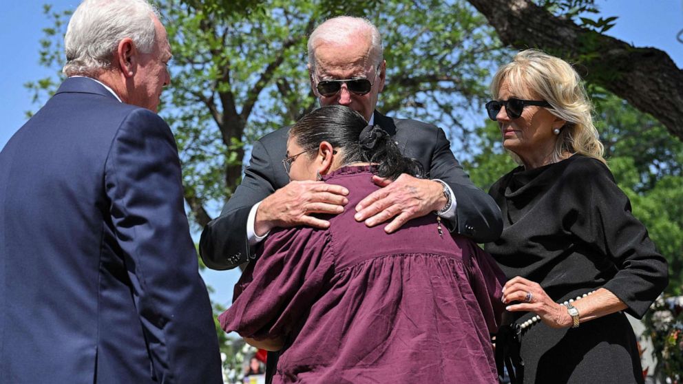 PHOTO: President Joe Biden embraces Mandy Gutierrez, the Pricipal of Robb Elementary School, as he and First Lady Jill Biden pay their in Uvalde, Texas, May 29, 2022.