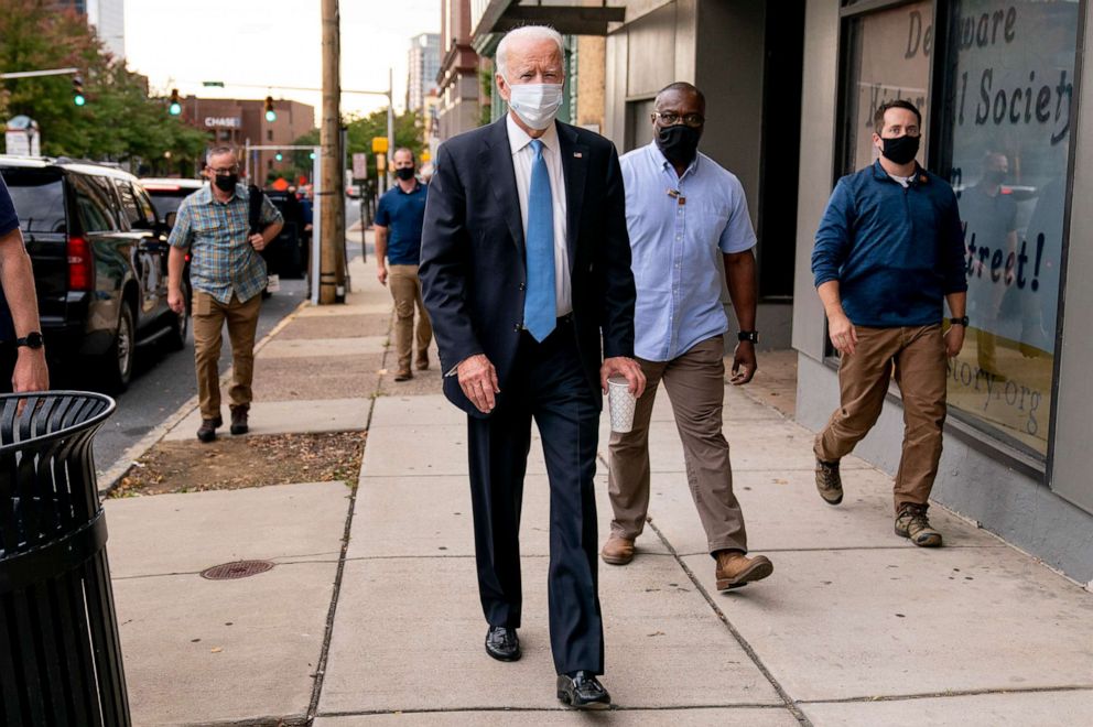 PHOTO: Democratic presidential candidate former Vice President Joe Biden stops to speak to members of the media as he walks out of the Queen Theater in Wilmington, Del.,  Oct. 1, 2020, after pre-taping his speech for the Al Smith dinner.