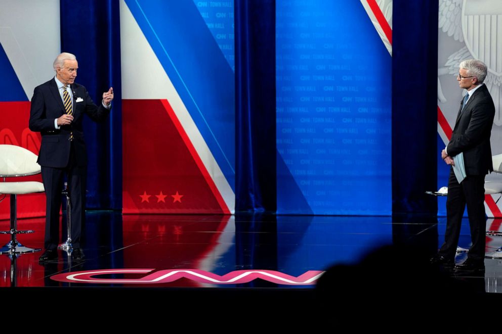 President Joe Biden speaks as CNN's Anderson Cooper listens during a televised town hall event at Pabst Theater on Tuesday, Feb. 16, 2021, in Milwaukee. 