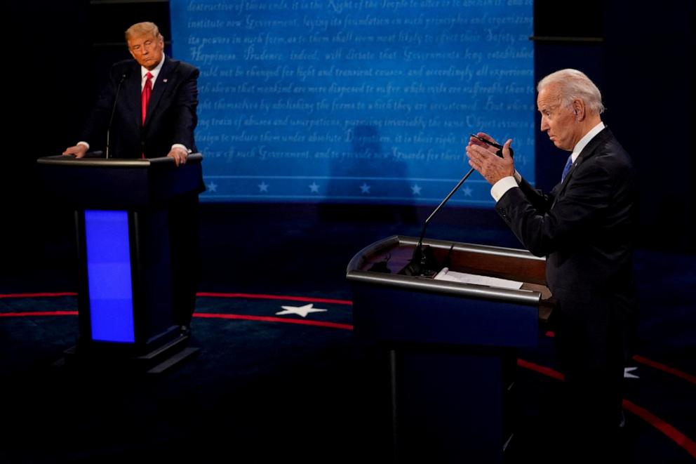 PHOTO: Democratic presidential candidate former Vice President Joe Biden answers a question as President Donald Trump listens during the second presidential debate in Nashville, Oct. 22, 2020. 