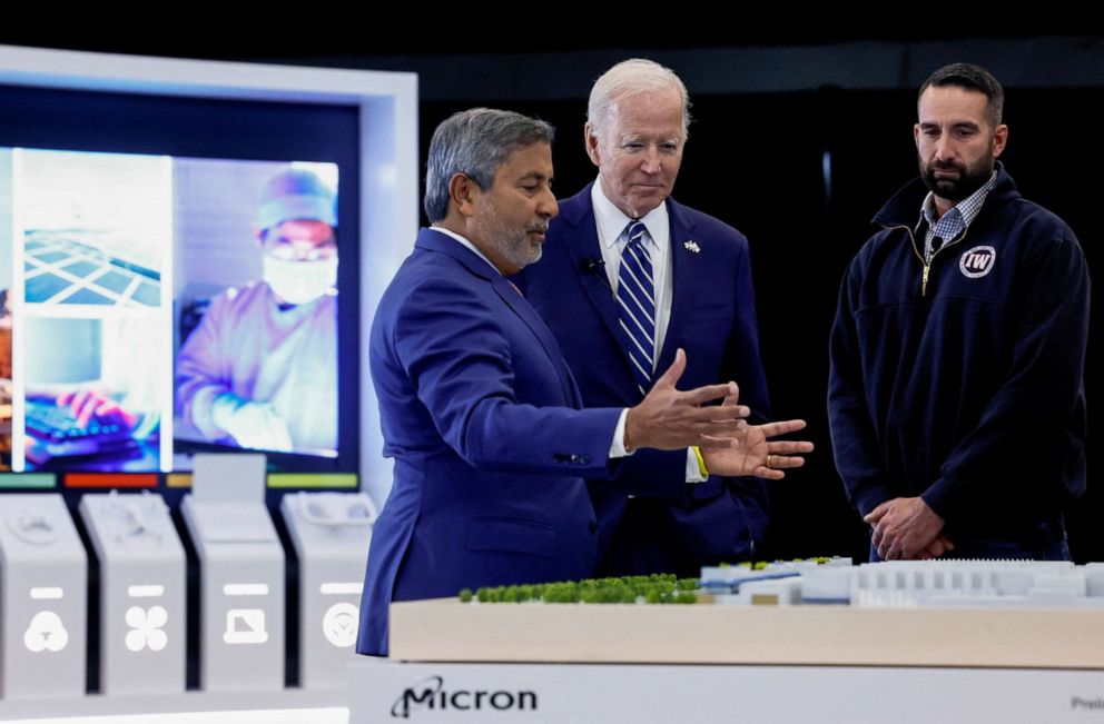 PHOTO: President Joe Biden tours Micron Pavilion with Micron President and Chief Executive Officer (CEO) Sanjay Mehrotra at Onondaga Community College in Syracuse, New York, October 27, 2022.