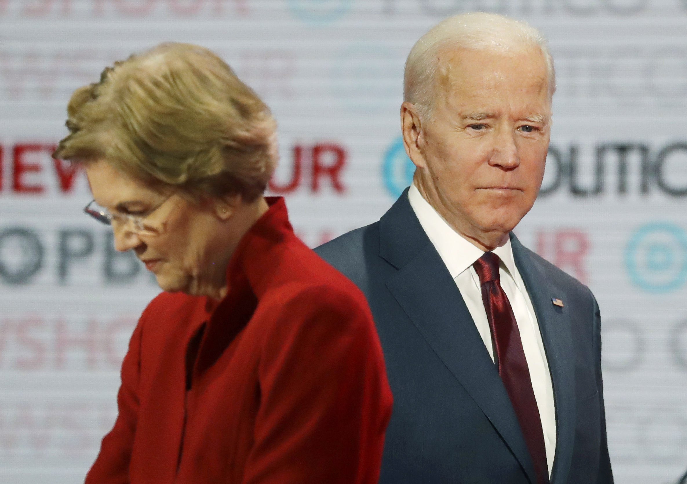 PHOTO: In this Dec. 19, 2019, file photo presumptive Democratic presidential candidates Sen. Elizabeth Warren, left, and former Vice President Joe Biden stand on stage during a break at a presumptive Democratic presidential primary debate in Los Angeles.