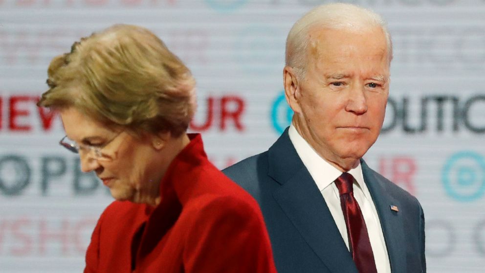 PHOTO: In this Dec. 19, 2019, file photo presumptive Democratic presidential candidates Sen. Elizabeth Warren, left, and former Vice President Joe Biden stand on stage during a break at a presumptive Democratic presidential primary debate in Los Angeles.