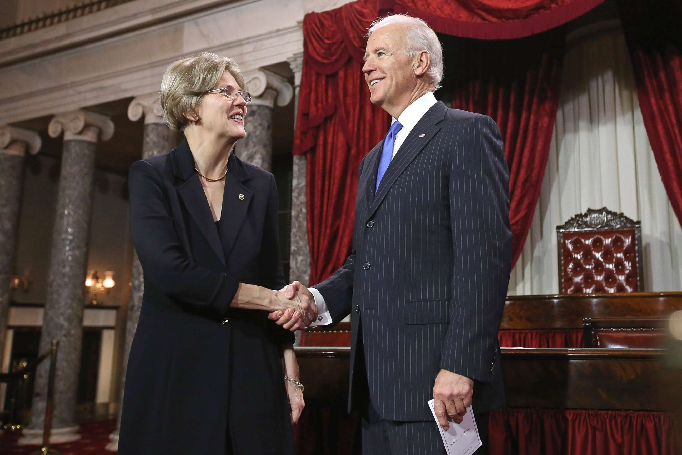 PHOTO: Sen. Elizabeth Warren participates in a reenacted swearing-in with Vice President Joe Biden in the Old Senate Chamber at the U.S. Capitol, Jan. 3, 2013, in Washington, DC.