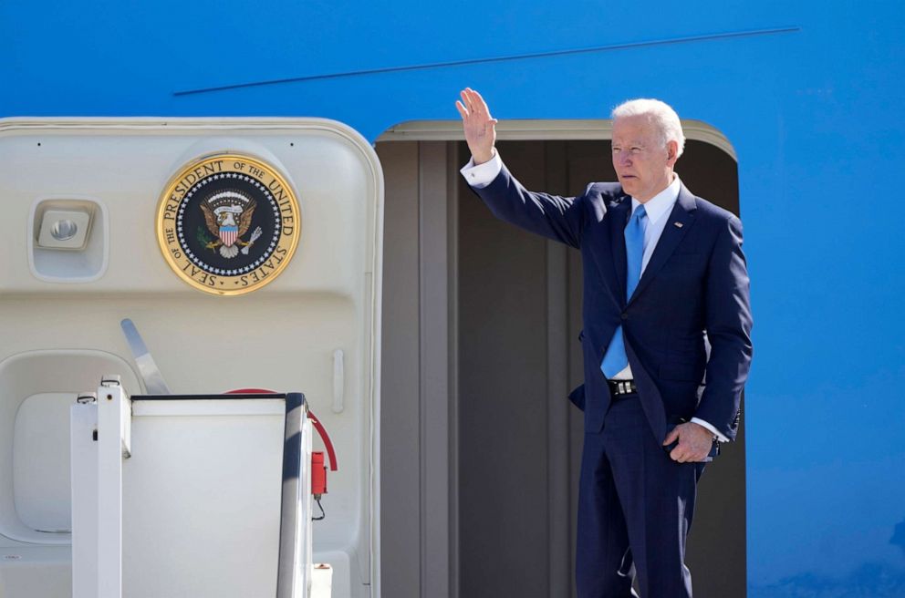 PHOTO: U.S. President Joe Biden waves as he boards Air Force One at Melsbroek military airport in Brussels, Belgium, March 25, 2022. 