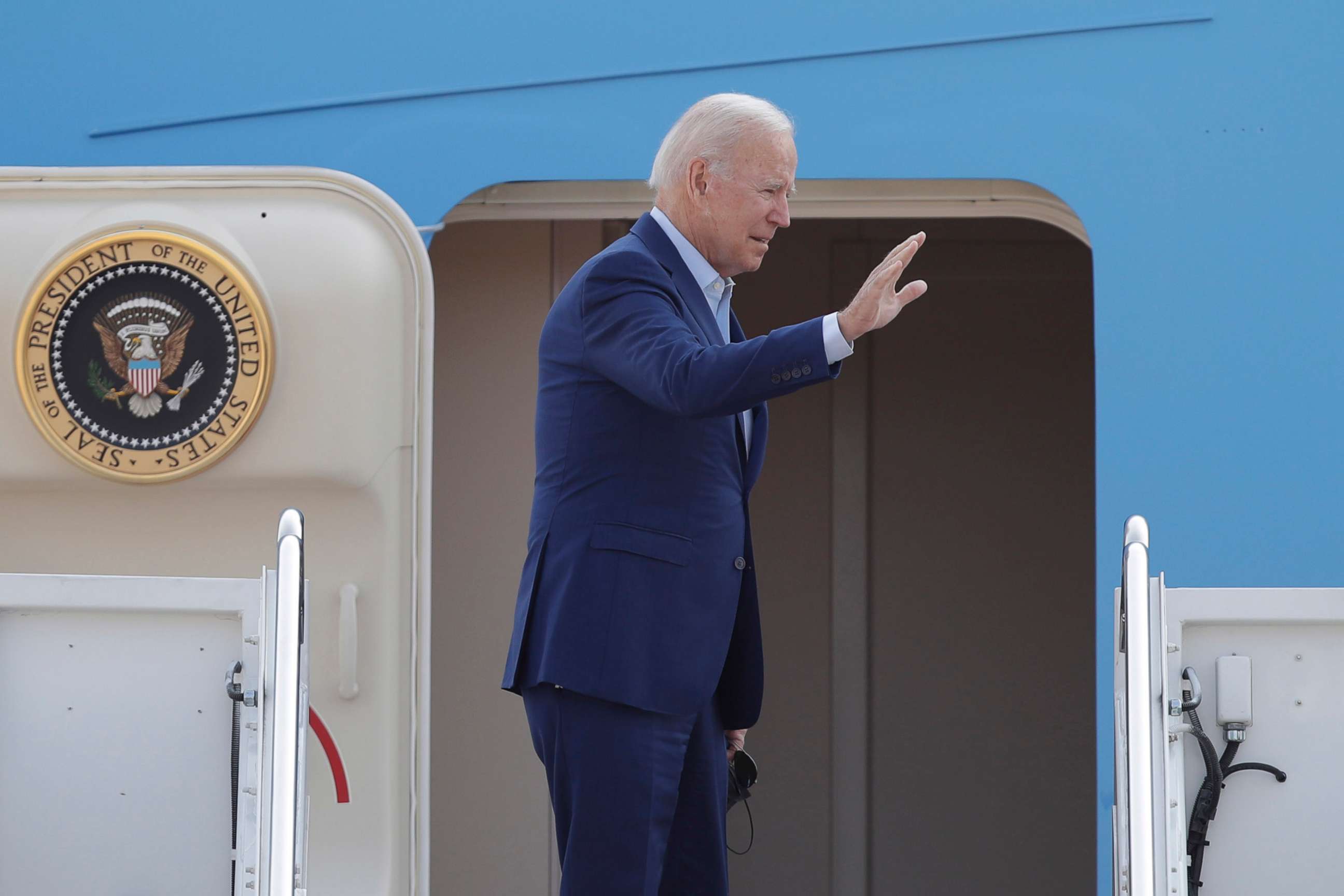 PHOTO: President Joe Biden waves from the stairs of Air Force One at Andrews Air Force Base, Md.,  Sept. 13, 2021.