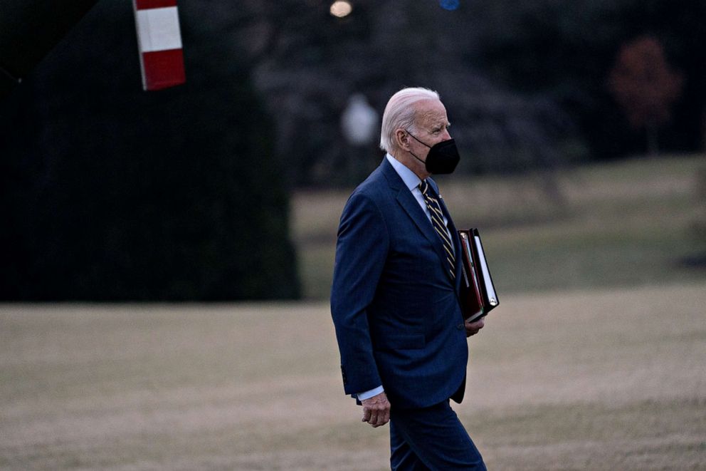 PHOTO: President Joe Biden walks on the South Lawn of the White House following an arrival on Marine One after accompanying First Lady Jill Biden to Walter Reed National Military Medical Center in Washington, DC, Jan. 11, 2023.