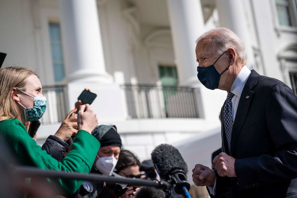 PHOTO: President Joe Biden talks briefly with reporters before boarding Marine One on the South Lawn of the White House on March 19, 2021, in Washington, D.C.