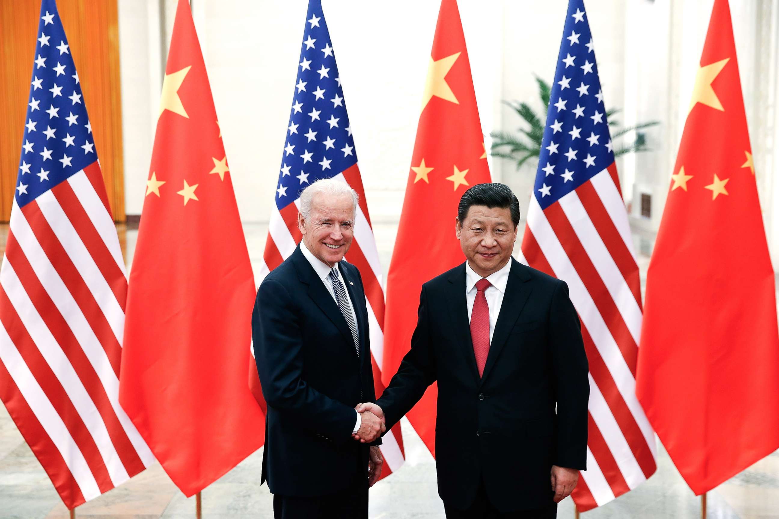 PHOTO: Chinese President Xi Jinping shakes hands with Vice President Joe Biden, left, inside the Great Hall of the People on Dec. 4, 2013, in Beijing.
