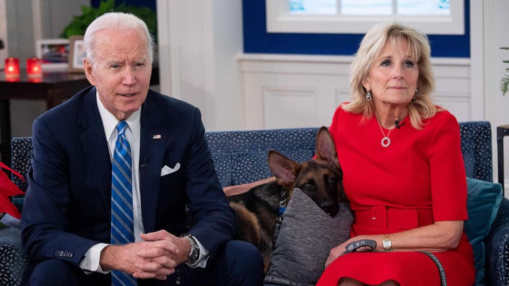 PHOTO: President Joe Biden and First Lady Jill Biden, with their new dog Commander, speak virtually with military service members to thank them for their service and wish then a Merry Christmas, Dec. 25, 2021.