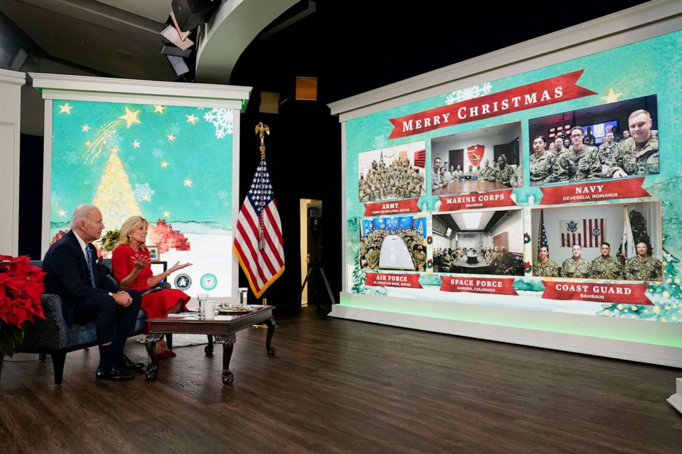 PHOTO: President Joe Biden, first lady Jill Biden and their new dog Commander, a purebred German shepherd puppy, meet virtually with service members around the world, Dec. 25, 2021.