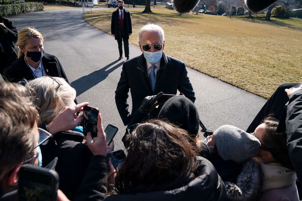 PHOTO: President Joe Biden talks with reporters after arriving on the South Lawn of the White House, Feb. 8, 2021, in Washington.