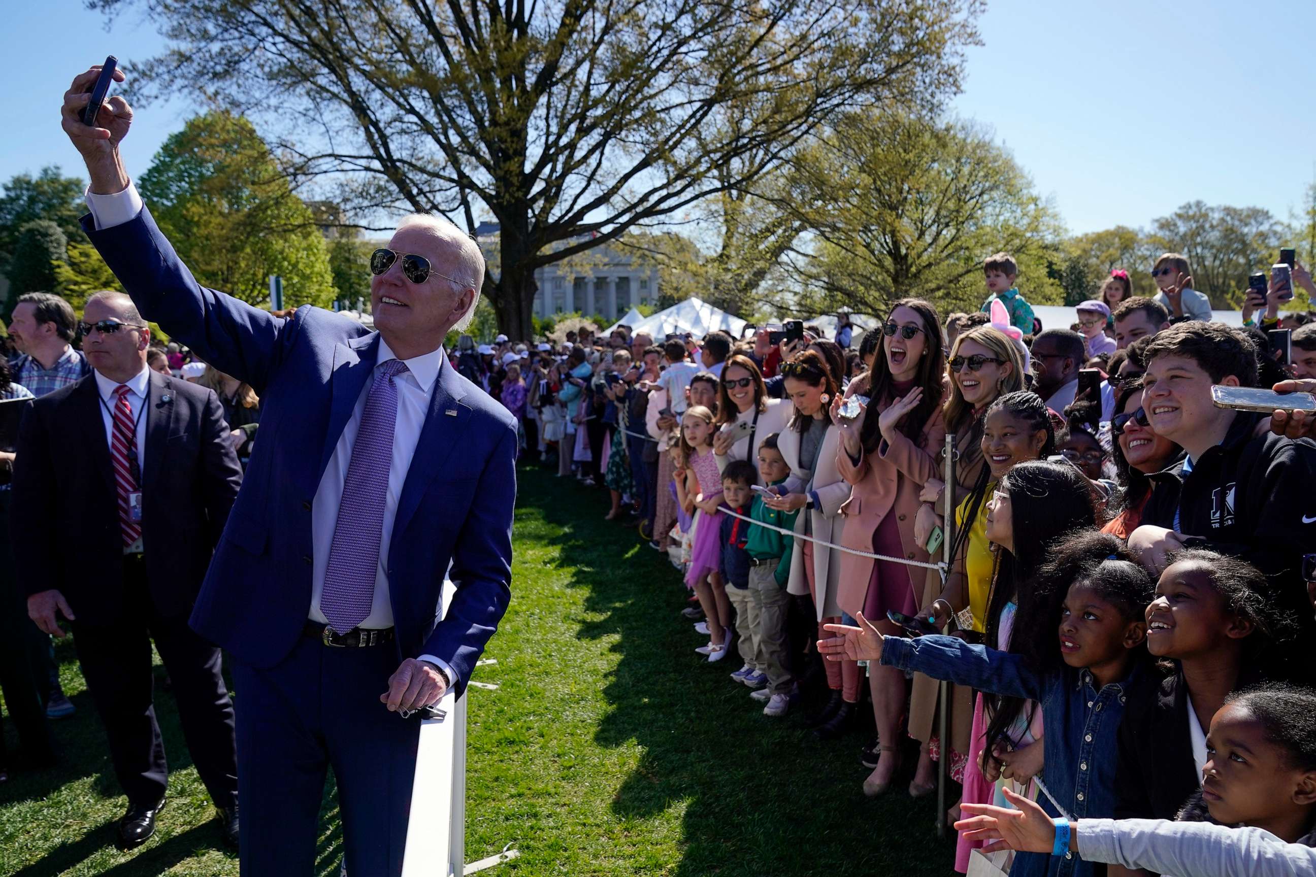 PHOTO: President Joe Biden takes a selfie with guests at the 2023 White House Easter Egg Roll, April 10, 2023, in Washington.
