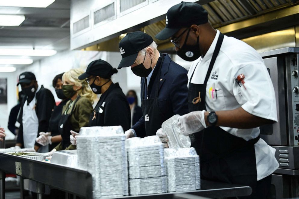PHOTO: President Joe Biden helps assemble Thanksgiving meal kits at the DC Central Kitchen in Washington, D.C., Nov. 23, 2021.