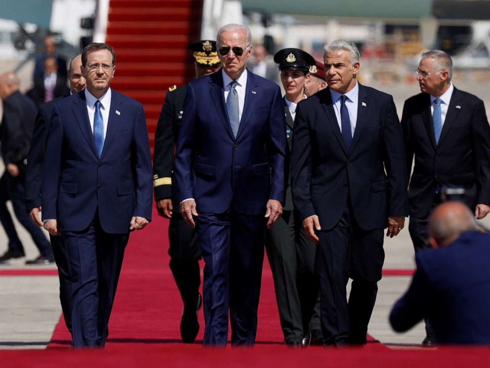 PHOTO: Israeli Prime Minister Yair Lapid and President Isaac Herzog welcome President Joe Biden as he lands for a three-day visit, at Ben Gurion International Airport in Lod near Tel Aviv, Israel, July 13, 2022.