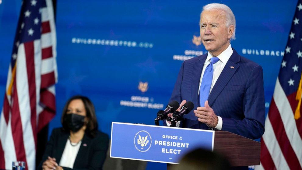PHOTO: President-elect Joe Biden speaks as Vice President-elect Kamala Harris listens at left, during an event to introduce their nominees and appointees to economic policy posts at The Queen theater, Dec. 1, 2020, in Wilmington, Del.