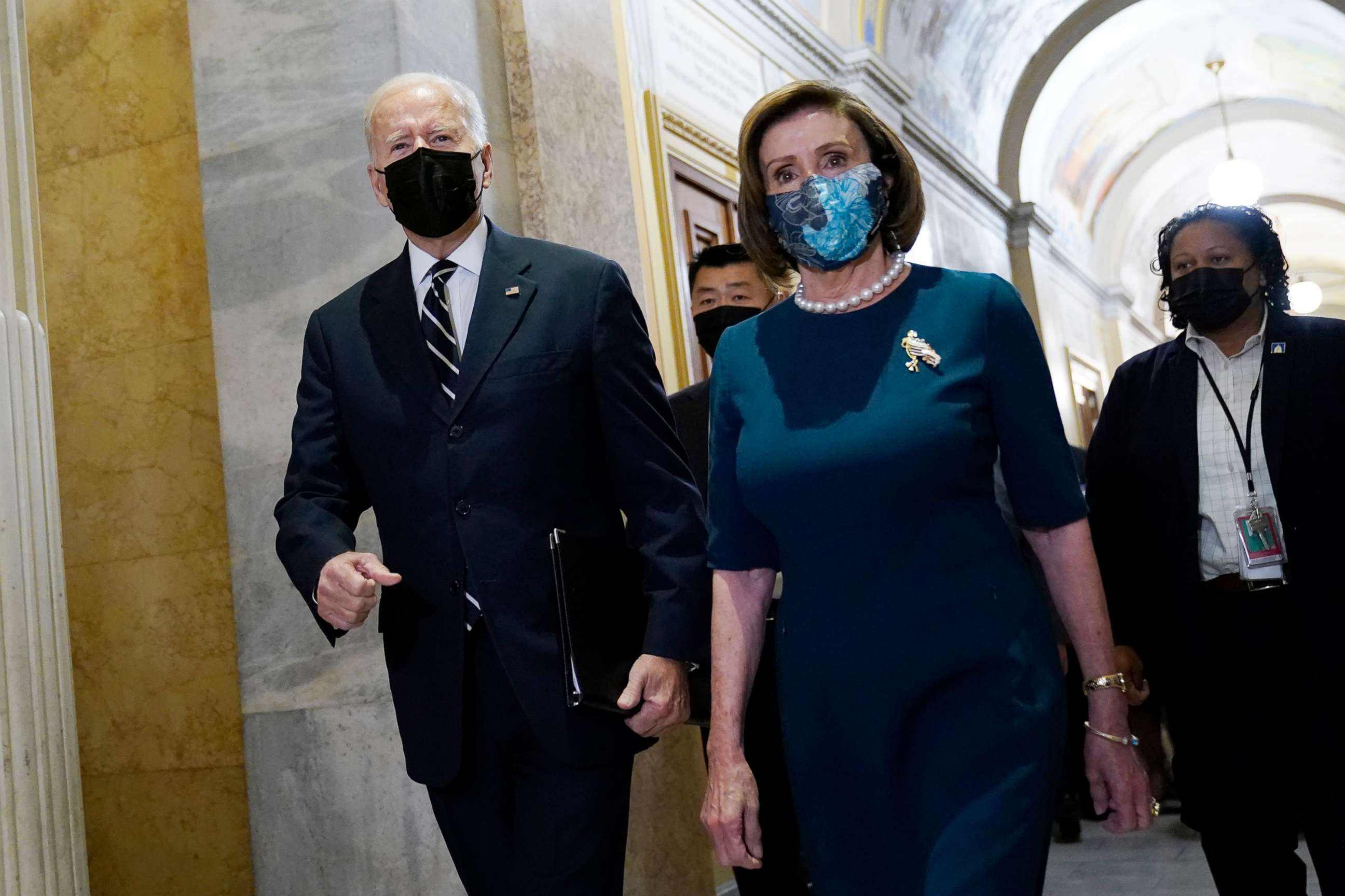 PHOTO: President Biden walks with Speaker of the House Nancy Pelosi on Capitol Hill in Washington, Oct. 28, 2021, during a visit to meet with House Democrats.