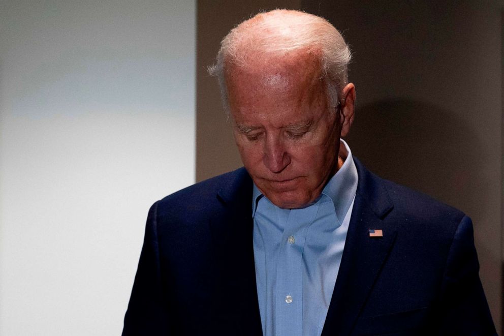 PHOTO: Democratic presidential candidate Joe Biden looks down as he delivers a statement on the passing of Supreme Court Justice Ruth Bader Ginsburg upon landing in New Castle, Delaware, on Sept. 18, 2020.
