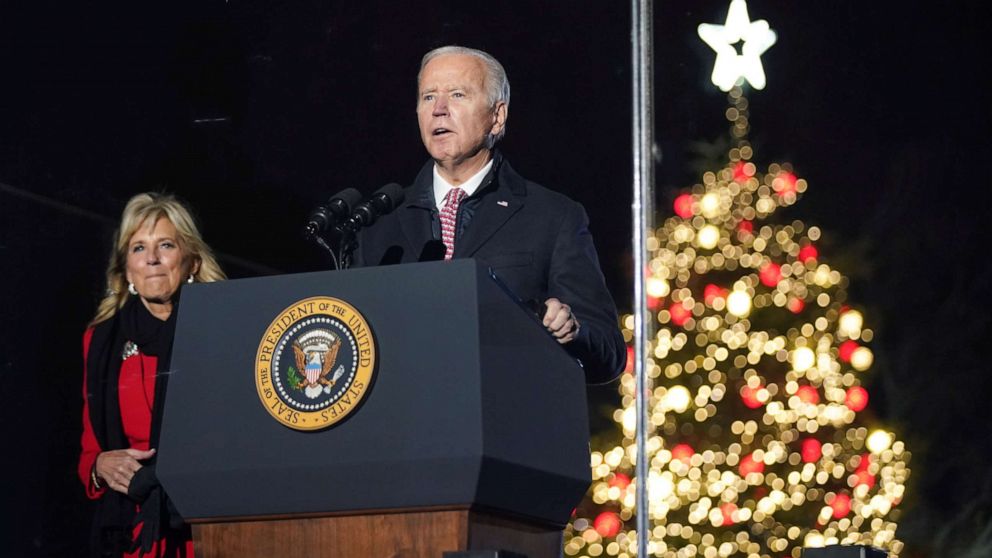 PHOTO: President Joe Biden, with first lady Jill Biden at his side, speaks during the National Christmas Tree Lighting ceremony in Washington, Dec. 2, 2021.