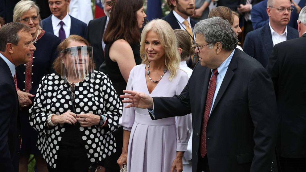 PHOTO: Former counselor to the president Kellyanne Conway, center, and Attorney General William Barr talk with guests in the Rose Garden after President Donald Trump introduced Amy Coney Barrett as nominee to the Supreme Court, Sept. 26, 2020.